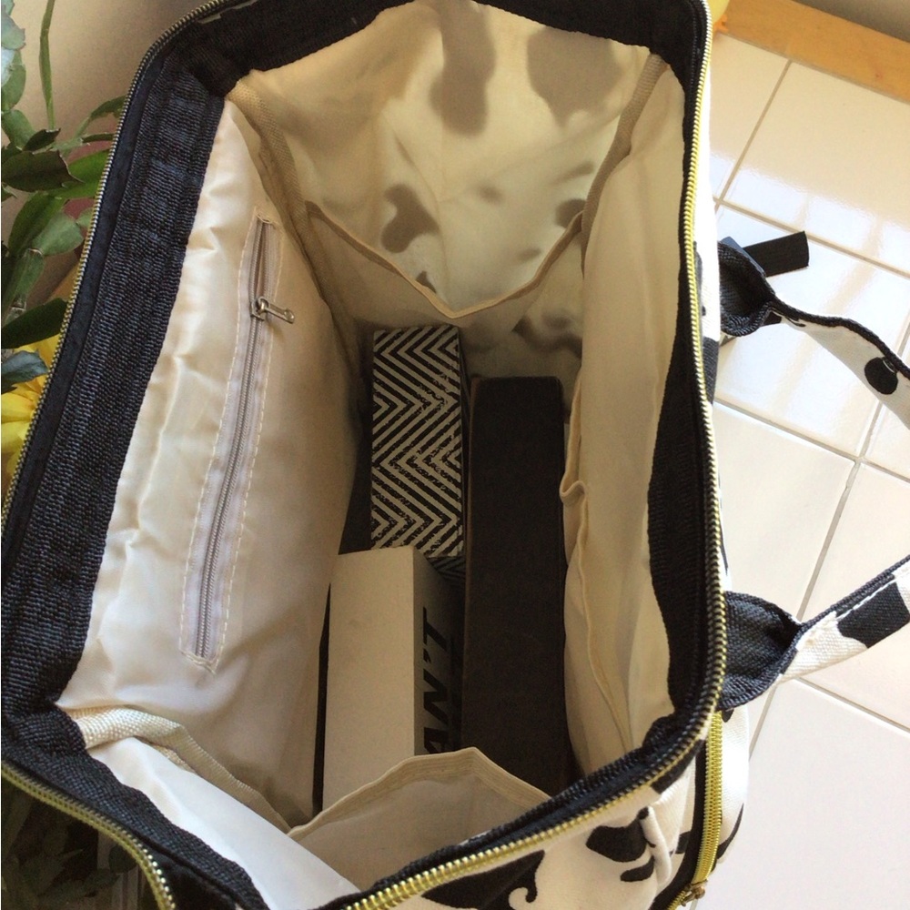 ‘Living Traveling Share’ Canvas Cow Print Backpack - Picture 5 of 8